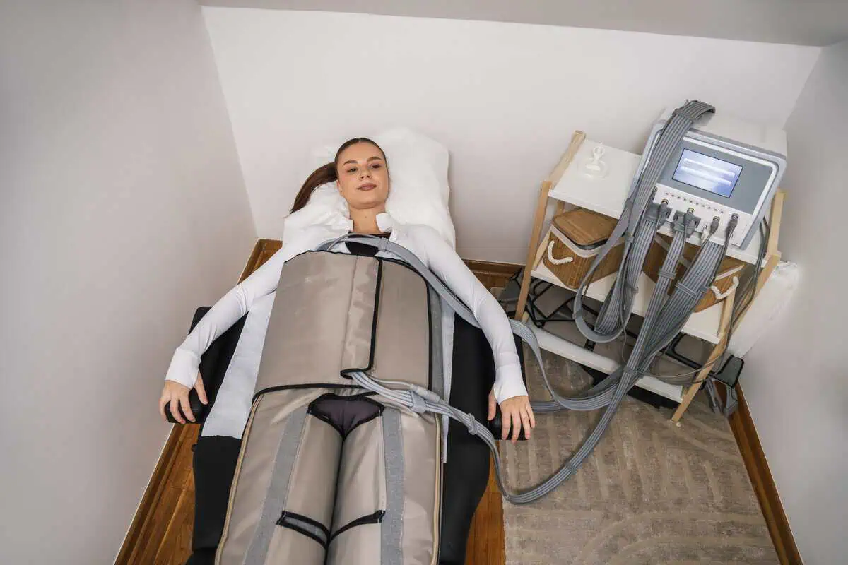 Patient receiving lymphatic compression therapy during a wellness session in Central Arkansas.